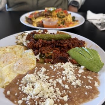 Huevos Avenue - Chileaquieles with added avocado and in house made chorizo and spices this chorizo is non greasy and full of flavor. - Mexican Near Me - Henderson, Nevada Huevos Avenue - Chileaquieles with added avocado and in house made chorizo and spices this chorizo is non greasy and full of flavor. - Mexican Near Me - Henderson, Nevada