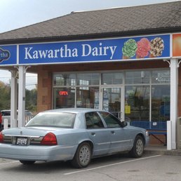 a car parked in front of a store a car parked in front of a store