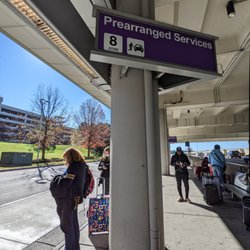 My RDU Airport Shuttle - Pickup at RDU: rideshare and "prearranged services" purple zone 8 ground transportation pickup area.