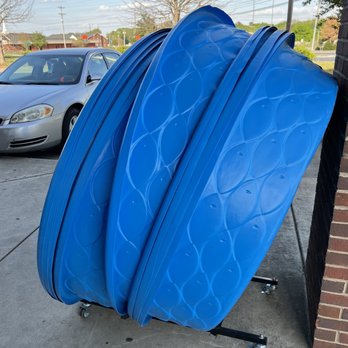 Dollar General - a pile of blue luggage on a cart - Grocery Near Me - Athens, Alabama