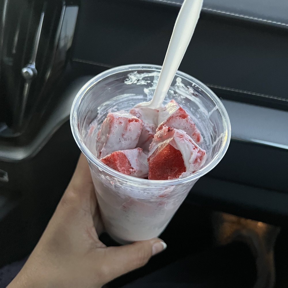 Paleteria Corazón Purépecha - hand holding a plastic cup filled with ice cream and strawberries - Ice Cream & Frozen Yogurt Near Me - Ukiah, California Paleteria Corazón Purépecha - hand holding a plastic cup filled with ice cream and strawberries - Ice Cream & Frozen Yogurt Near Me - Ukiah, California