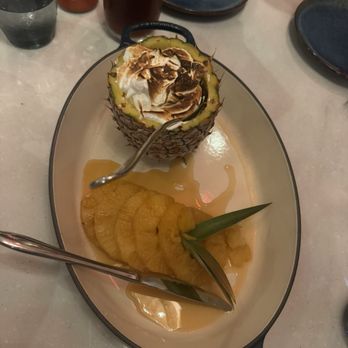 Koast - Coconut ice cream, lilikoi jam, and a tropical fruit meringue in a pineapple, with the pineapple fruit cooked in a caramel sauce - Seafood Near Me - Kihei, Hawaii
