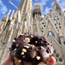 Costa Coffee - Chocolate-frosted Croissant Donut from Costa Coffee with Sagrada Família in the Background