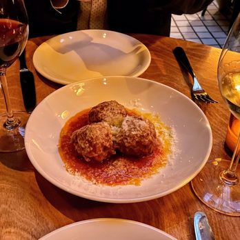 Etra - a plate of meatballs and wine glasses - Italian Near Me - Los Angeles, California Etra - a plate of meatballs and wine glasses - Italian Near Me - Los Angeles, California