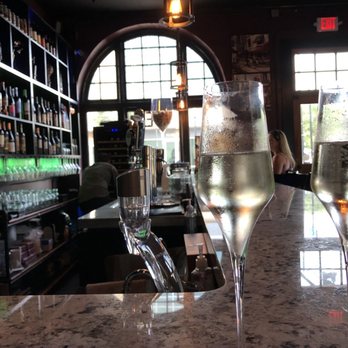 The Vine - two glasses of wine on a bar - Wine Bars Near Me - Wilmington, North Carolina The Vine - two glasses of wine on a bar - Wine Bars Near Me - Wilmington, North Carolina