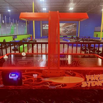 Jumping World - Kennesaw - Air hockey table with go kart track behind. - Trampoline Parks Near Me - Kennesaw, Georgia Jumping World - Kennesaw - Air hockey table with go kart track behind. - Trampoline Parks Near Me - Kennesaw, Georgia