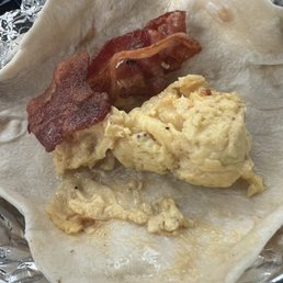Bacon and egg. Or half a slice and half an egg Bacon and egg. Or half a slice and half an egg