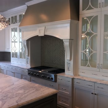 NWS Construction - a kitchen with white cabinets and a marble countertop - General Contractors Near Me - Austin, Texas NWS Construction - a kitchen with white cabinets and a marble countertop - General Contractors Near Me - Austin, Texas