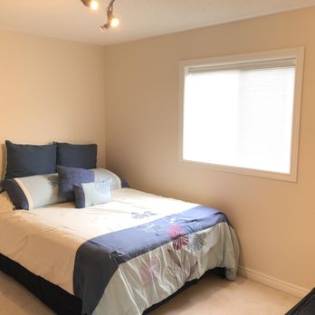 X Painting Renovation - a bedroom with a bed and window - Painters Near Me - Brampton, Ontario X Painting Renovation - a bedroom with a bed and window - Painters Near Me - Brampton, Ontario
