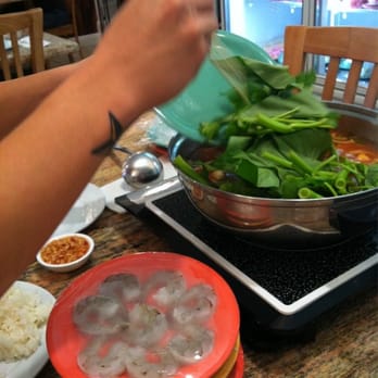Hot Pot Heaven - Kim chee broth.  There goes the bok Choy! - Vietnamese Near Me - Honolulu, Hawaii