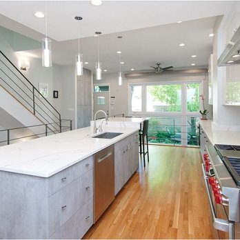 Trivic Remodelers - a kitchen with stainless steel appliances - General Contractors Near Me - Chicago, Illinois