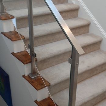 Yankee Decks - Another angle of the beautiful glass staircase lots of work highly customized  Compound angled glass  Hi end customized. - General Contractors Near Me