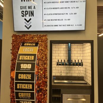Dabbler Depot - a counter with a sign that says, want to win? give me a spin - Beer, Wine & Spirits Near Me - Saint Paul, Minnesota