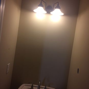 HomeFix pro - a bathroom with a sink and lights - Handyman Near Me HomeFix pro - a bathroom with a sink and lights - Handyman Near Me