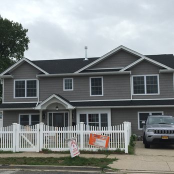 Dormer King - a grey house with a white picketer - General Contractors Near Me - West Babylon, New York Dormer King - a grey house with a white picketer - General Contractors Near Me - West Babylon, New York