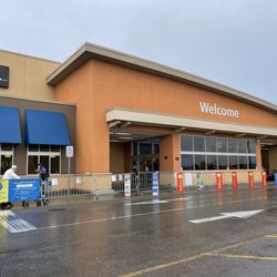 Walmart - View outside from the parking lot in July 2021 with front door visible in the alcove.