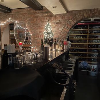 Grotta Azzurra - a bar with wine glasses and bottles - Italian Near Me - New York, New York