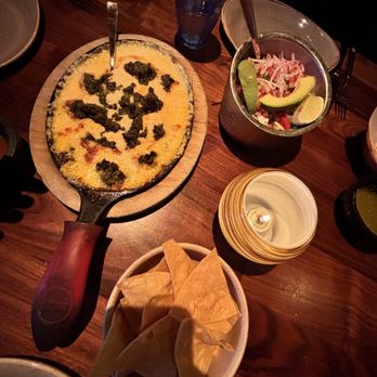 Fonda San Miguel - Queso fundido with added chorizo verde - Mexican Near Me - Austin, Texas Fonda San Miguel - Queso fundido with added chorizo verde - Mexican Near Me - Austin, Texas