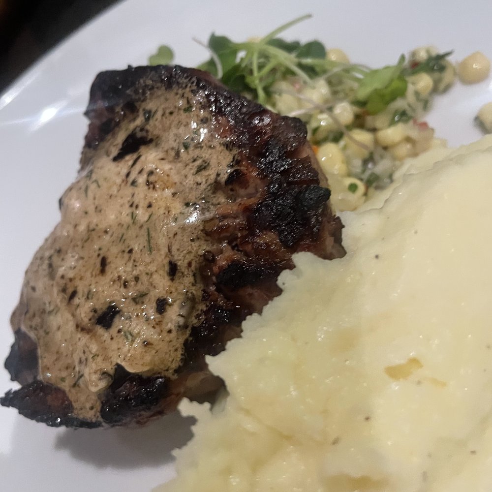 Bloomsbury Bistro - Dry Aged Filet with Yukon mashed potatoes, corn relish, and black gralic truffle butter - New American Near Me - Raleigh, North Carolina Bloomsbury Bistro - Dry Aged Filet with Yukon mashed potatoes, corn relish, and black gralic truffle butter - New American Near Me - Raleigh, North Carolina