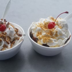 Town Trolley - The Caboose, left (hand dipped vanilla w/ marshmallow topping, hot fudge, whipped cream, pecans & a cherry) Hot fudge on right