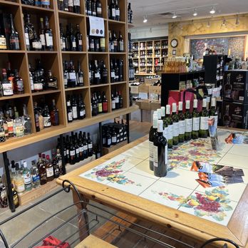 The Wine Thief - a table with a wine bottle on it - Beer, Wine & Spirits Near Me - New Haven, Connecticut The Wine Thief - a table with a wine bottle on it - Beer, Wine & Spirits Near Me - New Haven, Connecticut