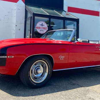 Main Street Bakery - a red car parked in front of the restaurant - Donuts Near Me - Hopkins, Michigan Main Street Bakery - a red car parked in front of the restaurant - Donuts Near Me - Hopkins, Michigan
