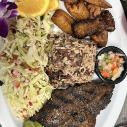 Asada, rice and beans, cabbage salad, plantains and Asada, rice and beans, cabbage salad, plantains and
