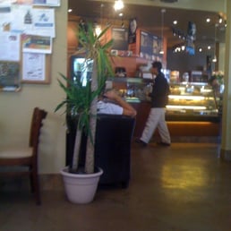 a man walking through a coffee shop a man walking through a coffee shop