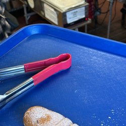 Panamericana Bakery - Elote pan dulce featuring their tamales, and atole stations in the back