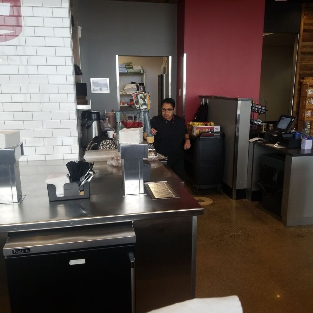 a man working in a coffee shop
