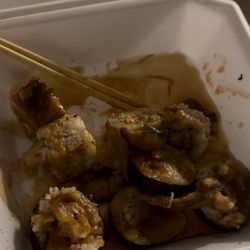 Fuji Sushi & Grill - Spider roll & dragon roll with lots of eel sauce puddled on the bottom and top of sushi