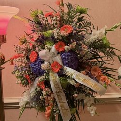 Driscoll's Florist - Standing Sprays to flank the casket. We specifically asked for Coral, Blue and White!