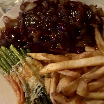 Heisman Court Grill - Ribeye with sautéed onions and red wine demi glacé, fries, and asparagus. - Steakhouses Near Me - Hudson Falls, New York Heisman Court Grill - Ribeye with sautéed onions and red wine demi glacé, fries, and asparagus. - Steakhouses Near Me - Hudson Falls, New York