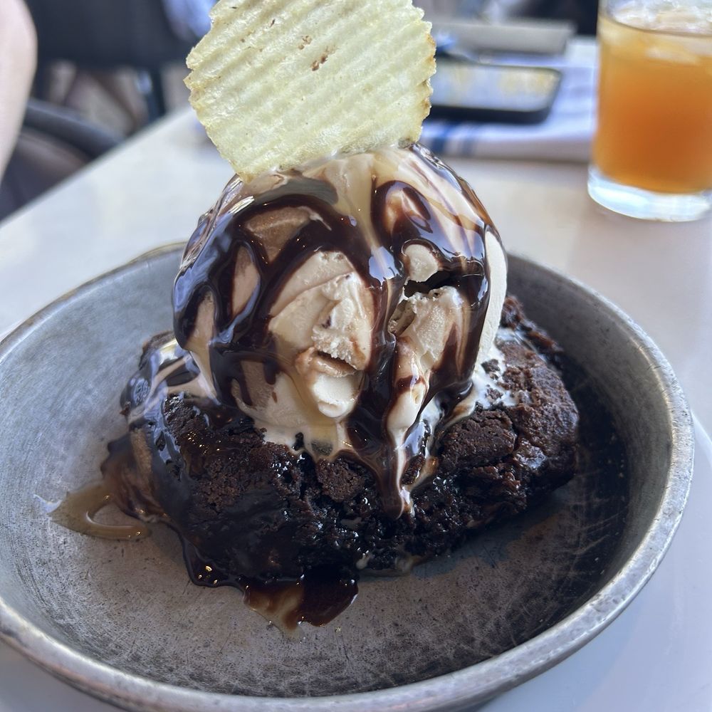 Thompson 105 - Skillet brownie with caramel ice cream and potato chip. - Italian Near Me - Scottsdale, Arizona Thompson 105 - Skillet brownie with caramel ice cream and potato chip. - Italian Near Me - Scottsdale, Arizona