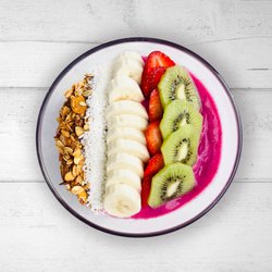Juicygreens - Pitaya Mama:
Dragon fruit, pineapple, banana, coconut milk. Toppings: kiwi, strawberries, banana, coconut flakes, and house made granola
