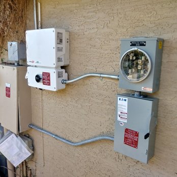 Elevation - Old panel on left.  Inverter at center.  New meter and disconnect on right. - Solar Installation Near Me - Chandler, Arizona