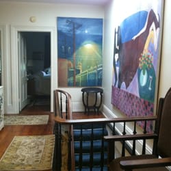 Brownstone Inn - Eclectic works of art adorn the walls of the third floor hall.