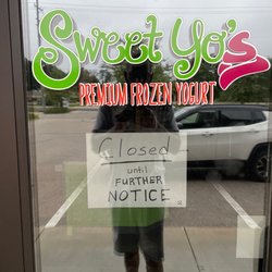 Sweet Yos - For lease sign in window.