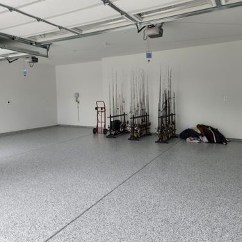 Garage Design Source - Just the start of storing items on the beautifully finished new floor.  Hope I have enough fishing rods!! - Flooring Near Me - Sterling, Virginia