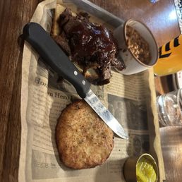 Brisket entree with baked beans and potato pancake Brisket entree with baked beans and potato pancake