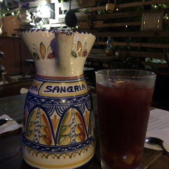 Choo-Choo Churros - Yummy red sangria served in this beautiful ceramic pitcher. - Steakhouses Near Me - Orlando, Florida