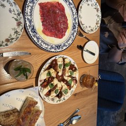 Fresh mozzarella, focaccia bread and beef carpaccio Fresh mozzarella, focaccia bread and beef carpaccio