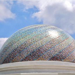 Look up on top of the Rimowa store building: A dome by artist Peter Veres: 14-ft. diameter made of 69,000 Venetian glass tiles. Look up on top of the Rimowa store building: A dome by artist Peter Veres: 14-ft. diameter made of 69,000 Venetian glass tiles.