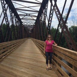 Me standing on the beautiful re done bike trail bridge