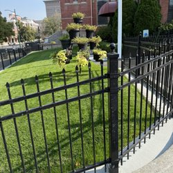 Our Lady of Lourdes Cathedral - Green grass in front of the main office and parking lot.