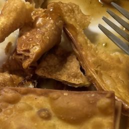 Cold greasy crab Rangoon. Cold greasy crab Rangoon.