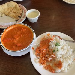 Tandoor Indian Cuisine - Chicken tikka korma over rice and naan bread