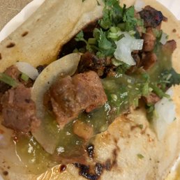 Taco al pastor with green sauce Taco al pastor with green sauce