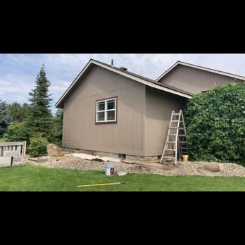 Outlander Construction - Painting an addition on the customers house - General Contractors Near Me