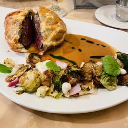 Goldmoor Dining & Spirits - Beef Wellington with fall vegetables.